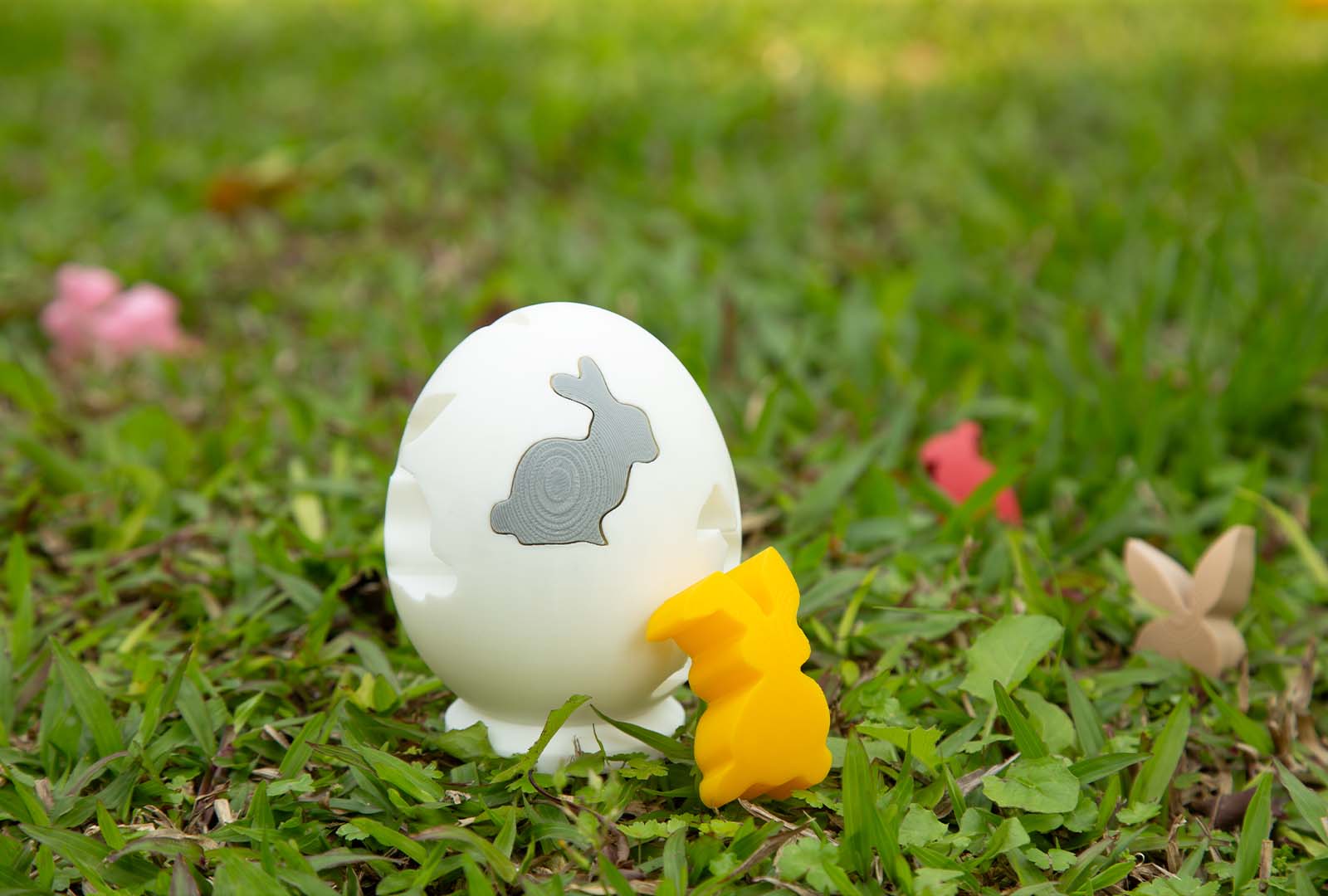 A 3D printed Easter egg puzzle with colorful pieces arranged on a surface.