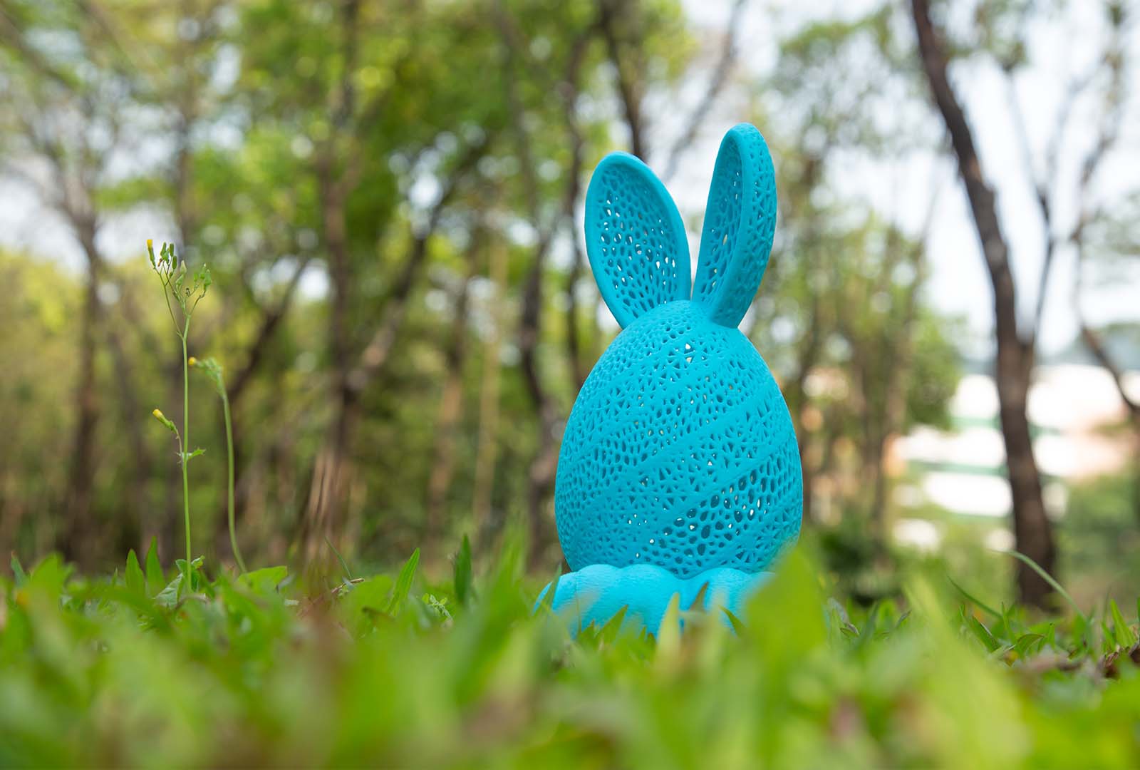 3D printed bunny-shaped egg decoration with internal lighting showing the illuminated design.