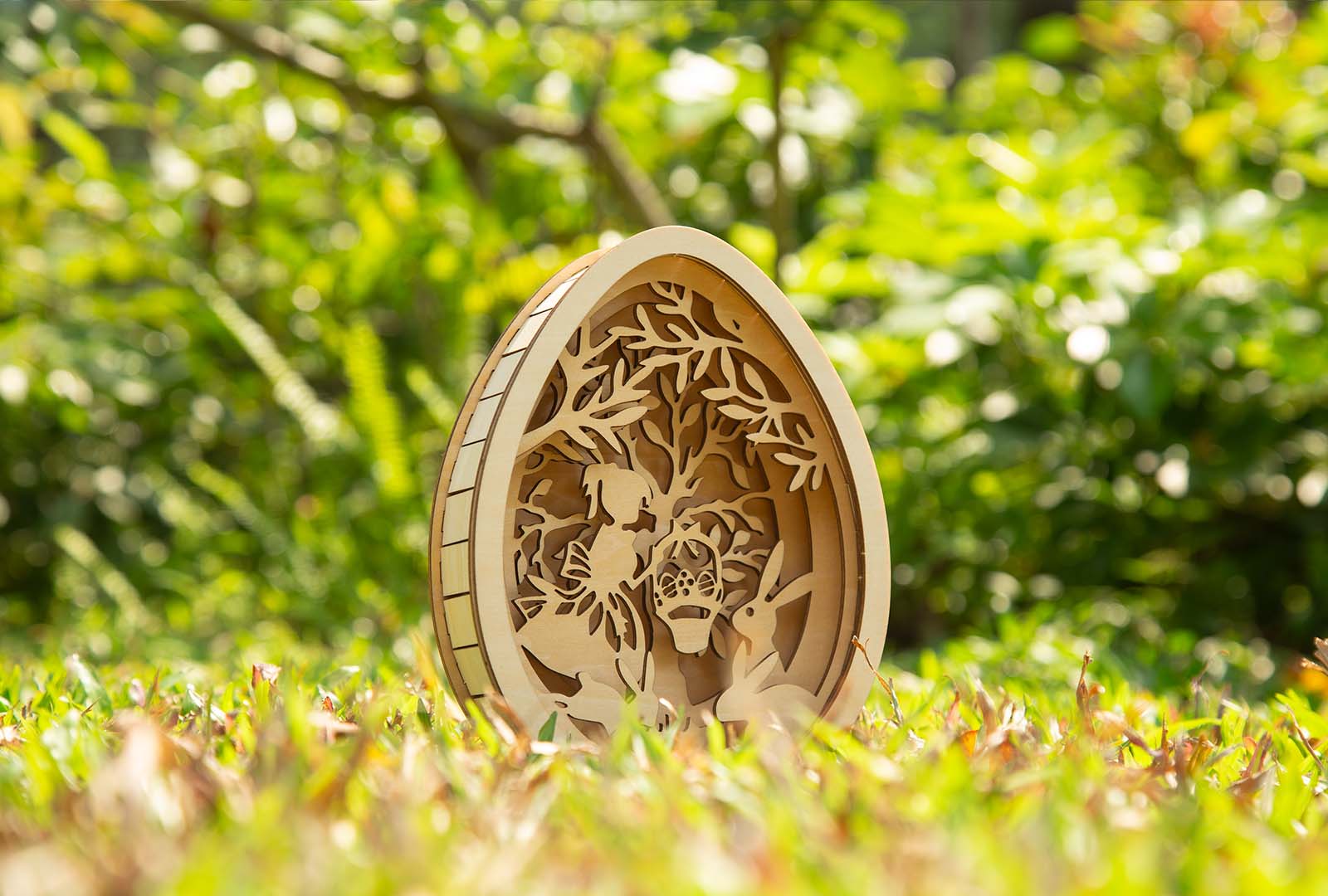 Close-up view of layered laser cut Easter egg decoration showing intricate patterns and layers.